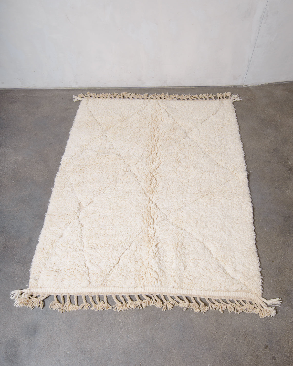 Modern, designer, handcrafted Berber rug from Morocco. Beniourain carpet with minimalist design, natural wool pile and a fluffy texture.